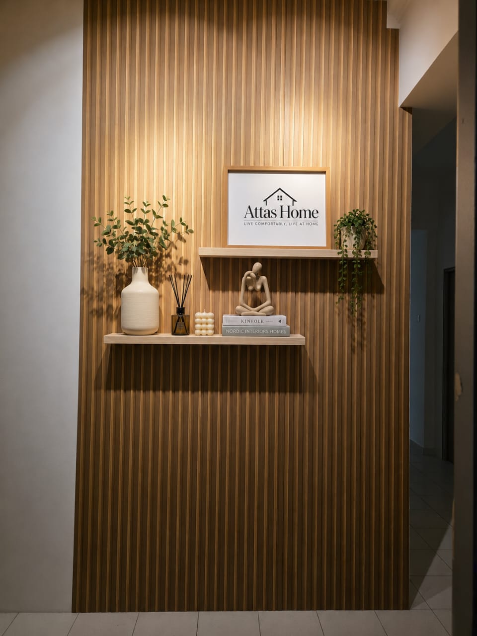Attas Home branded feature wall with warm wood paneling